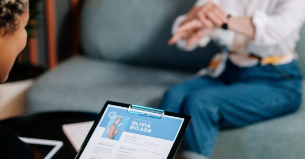 pexels photo 5989924 5989924 A senior woman being interviewed indoors with her resume displayed.